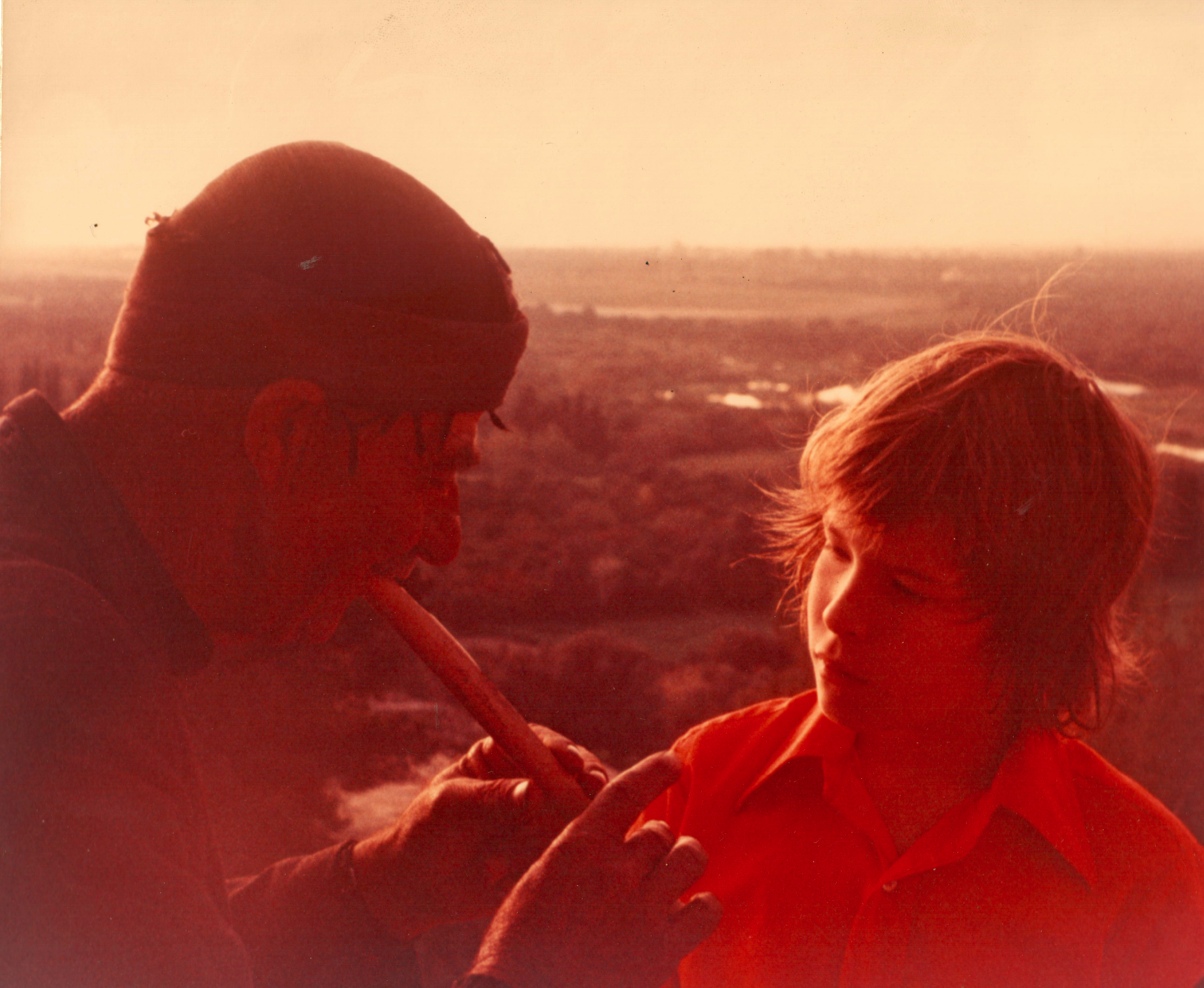 a picture of me with a musician in Morocco playing a recorder-like instrument in 1972 taken by my Dad