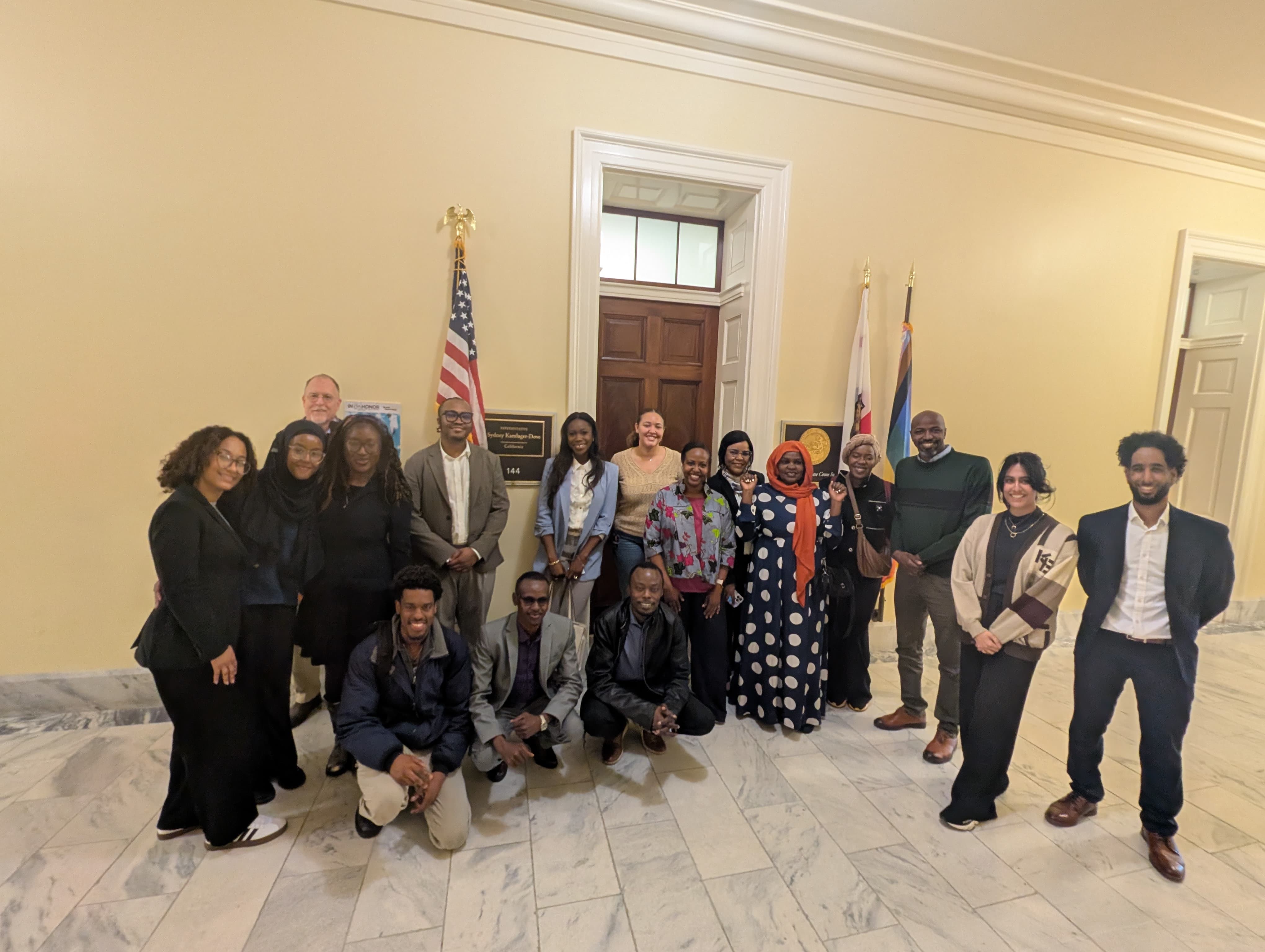 people gathered outside a congressional office